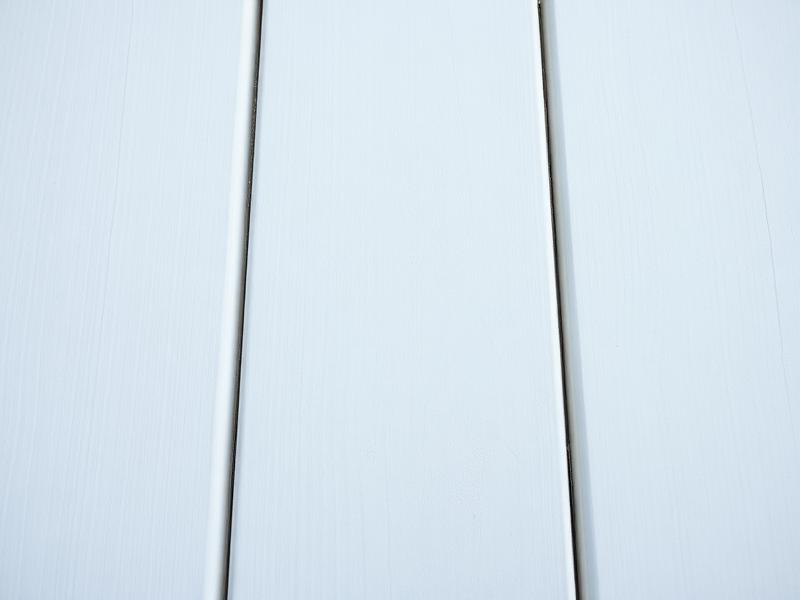 Close-up of smooth white-gray PVC deck boards